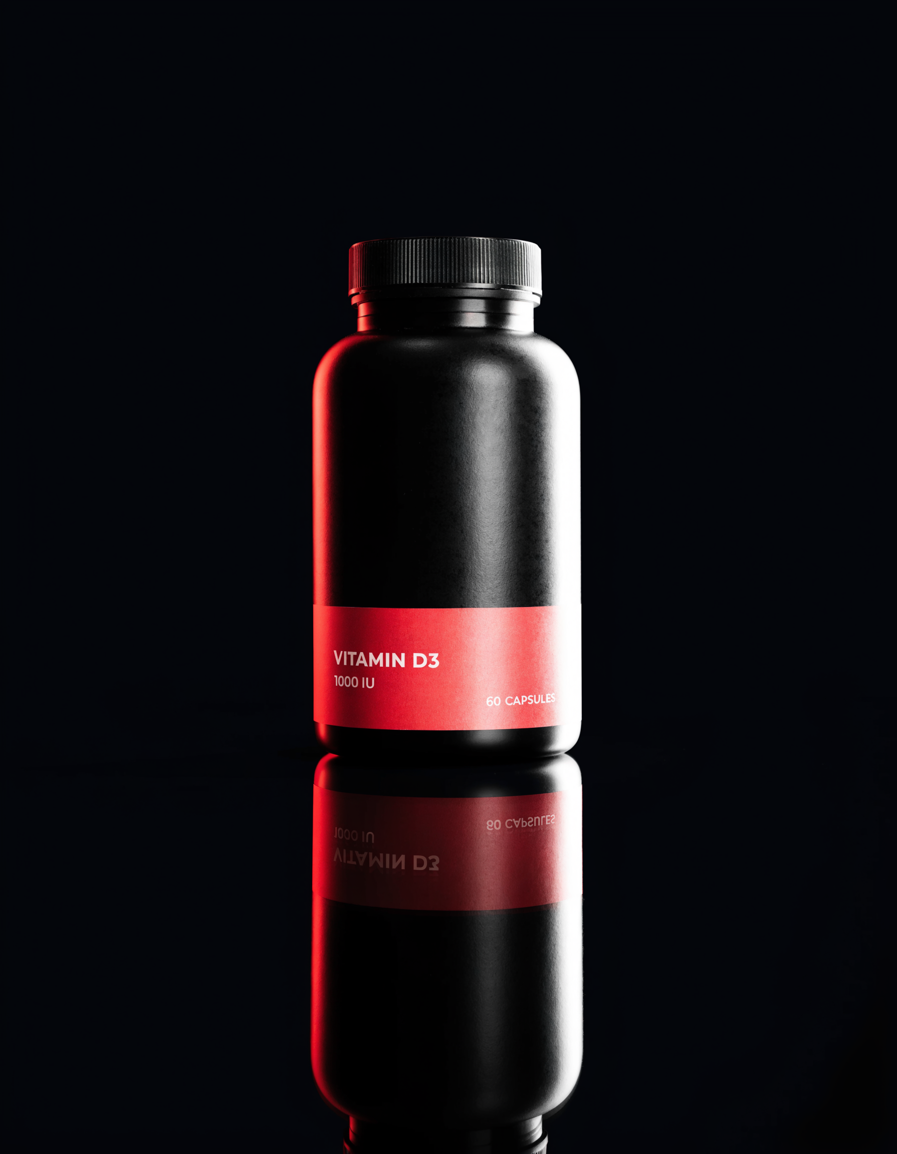 Matte black supplement bottle with a red label band